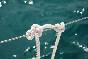 Faxco triple-strand cotton rope showcasing natural beige fibers and secure grip texture for climbing holds