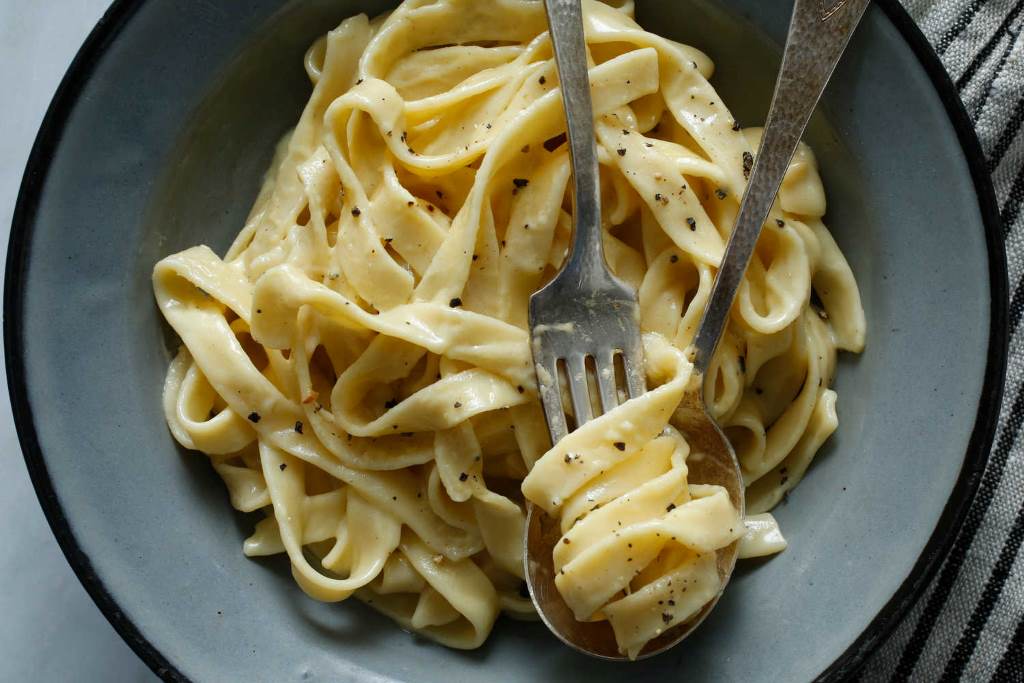 bronze die creating rough-textured fettuccine that holds creamy Alfredo sauce perfectly