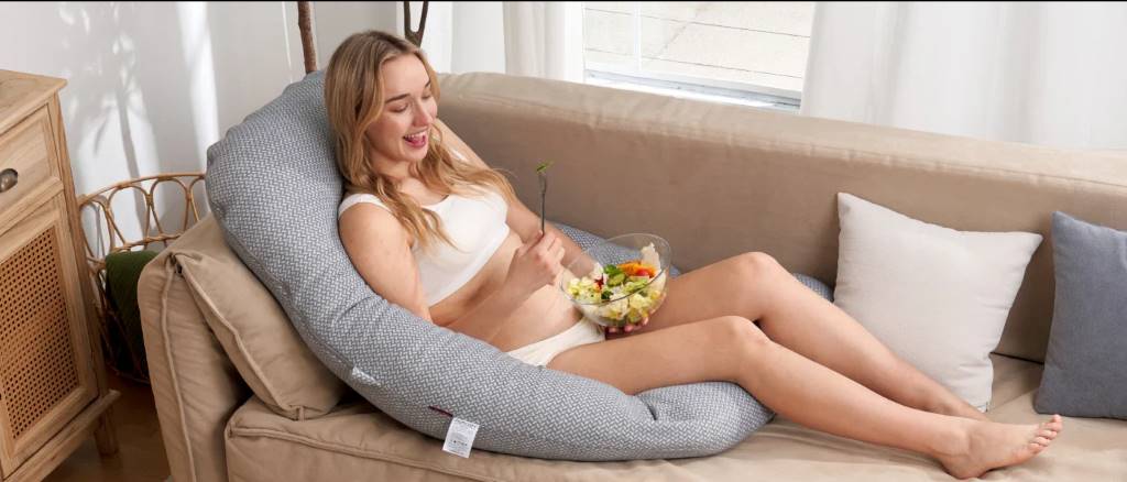 Momcozy vs Boppy nursing pillows showing shape differences