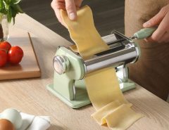 Sur La Table Va Bene pasta maker on a countertop with fresh pasta.