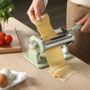 Sur La Table Va Bene pasta maker on a countertop with fresh pasta.