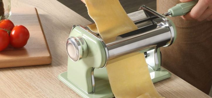 Sur La Table Va Bene pasta maker on a countertop with fresh pasta.