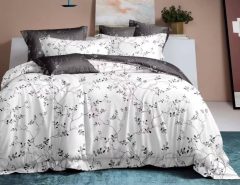 Affordable queen bed sheets and comforter set on a neatly made modern bed.