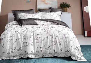 Affordable queen bed sheets and comforter set on a neatly made modern bed.