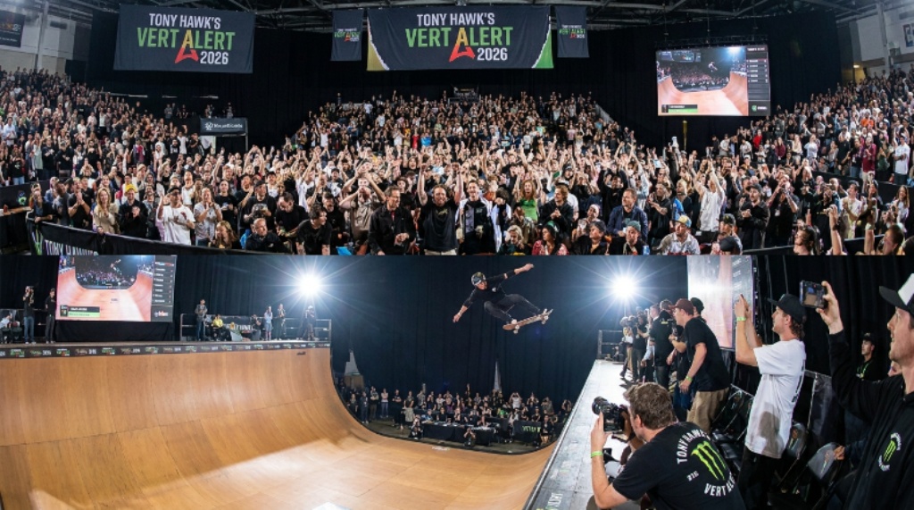Crowd watching professional vert skateboarding competition at Tony Hawk's Vert Alert 2026 indoor event