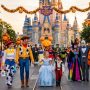 Guests in costumes enjoying Magic Kingdom during the fall Halloween event