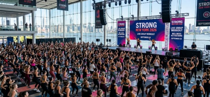 Thousands of fitness enthusiasts participating in live group workout sessions and wellness activations at Strong New York 2026 inside The Glasshouse NYC on September 26