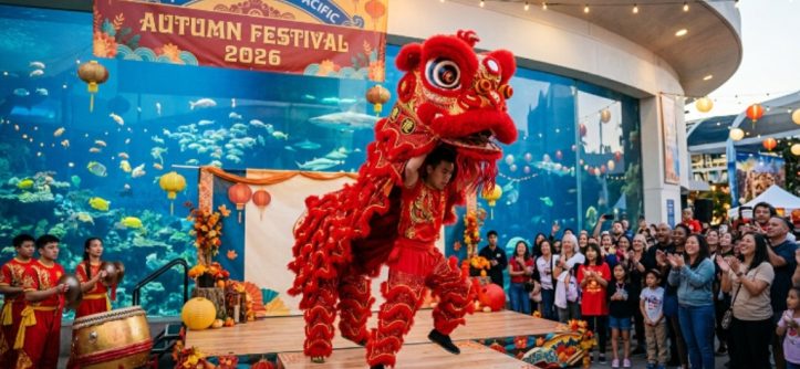 Lion dancer in bright red costume performing at the Aquarium of the Pacific Autumn Festival 2026 in Long Beach