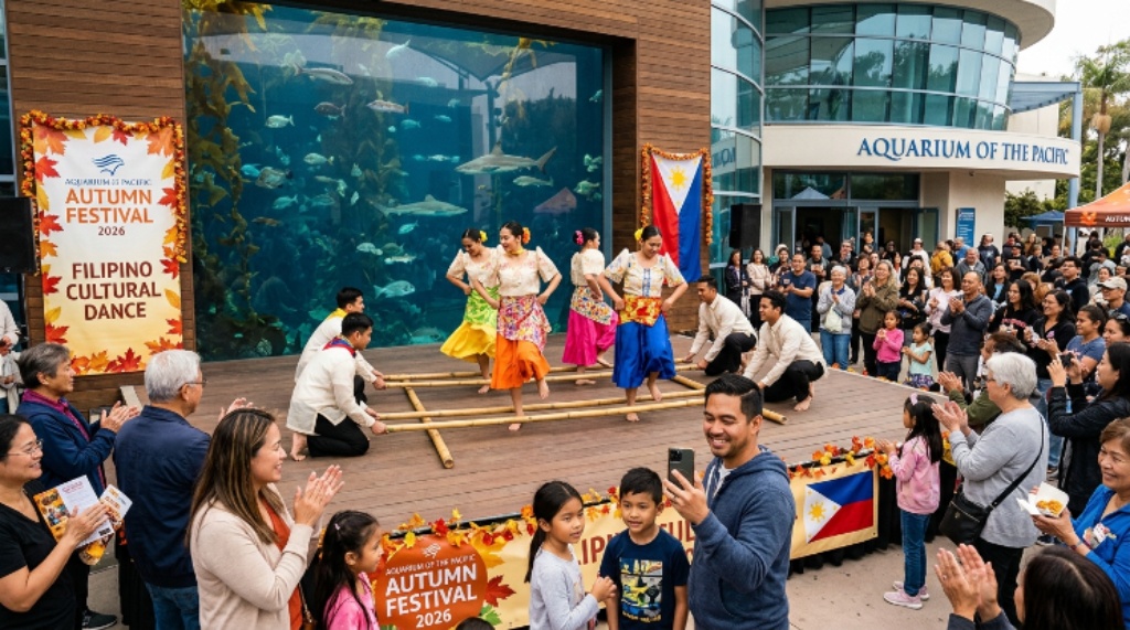 Visitors watching Filipino folk dancers in traditional costumes at the 2026 Aquarium of the Pacific Autumn Festival